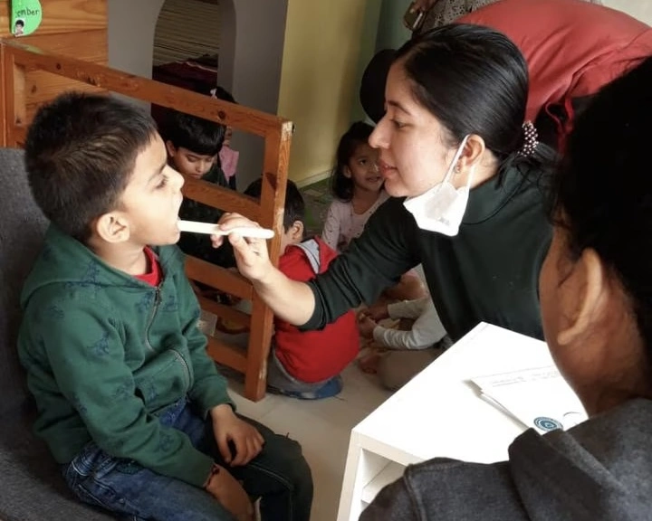 Children receiving dental checkups during the outreach program