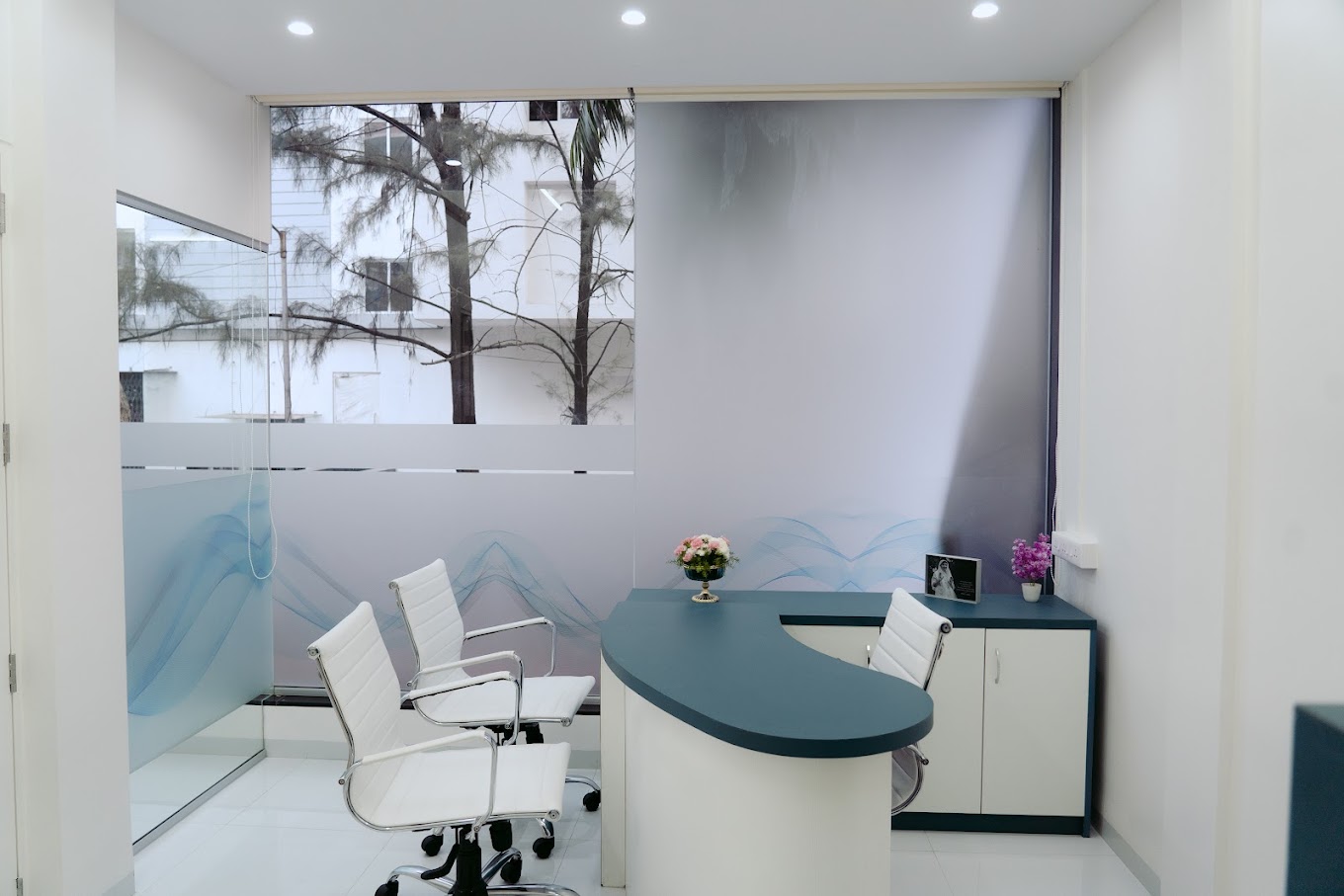 A consultation area in a dental clinic with comfortable seating and a warm ambiance