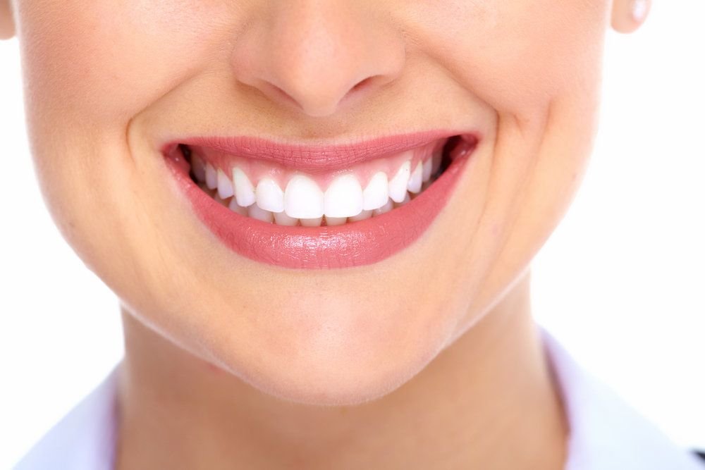 Natural healthy smile with bright teeth and healthy gums showing authentic smile aesthetics