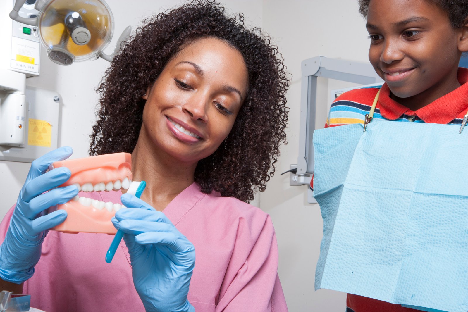 Patient discussing preventive dental care with a dentist in a modern clinic